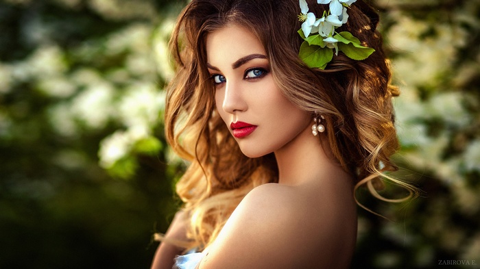 Portrait of a woman with blue eyes and red lipstick