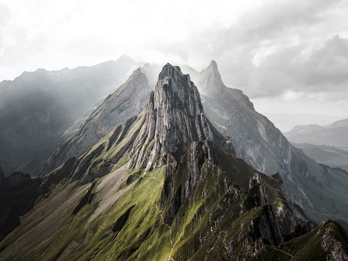 Sharp mountain peaks in Switzerland under cloudy sky