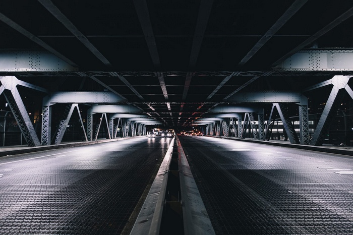 Underneath a bridge in New York City at night
