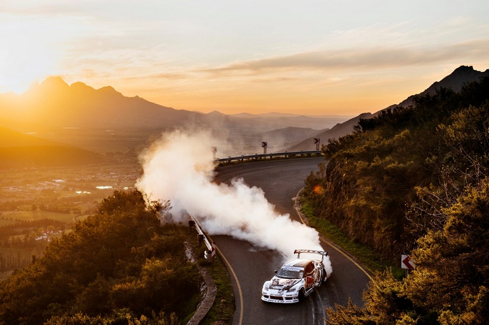 Mad Mike Drifting Sports Car on Franschhoek Pass at Sunset