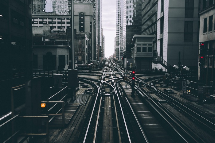 Elevated train tracks in Chicago with buildings and signals