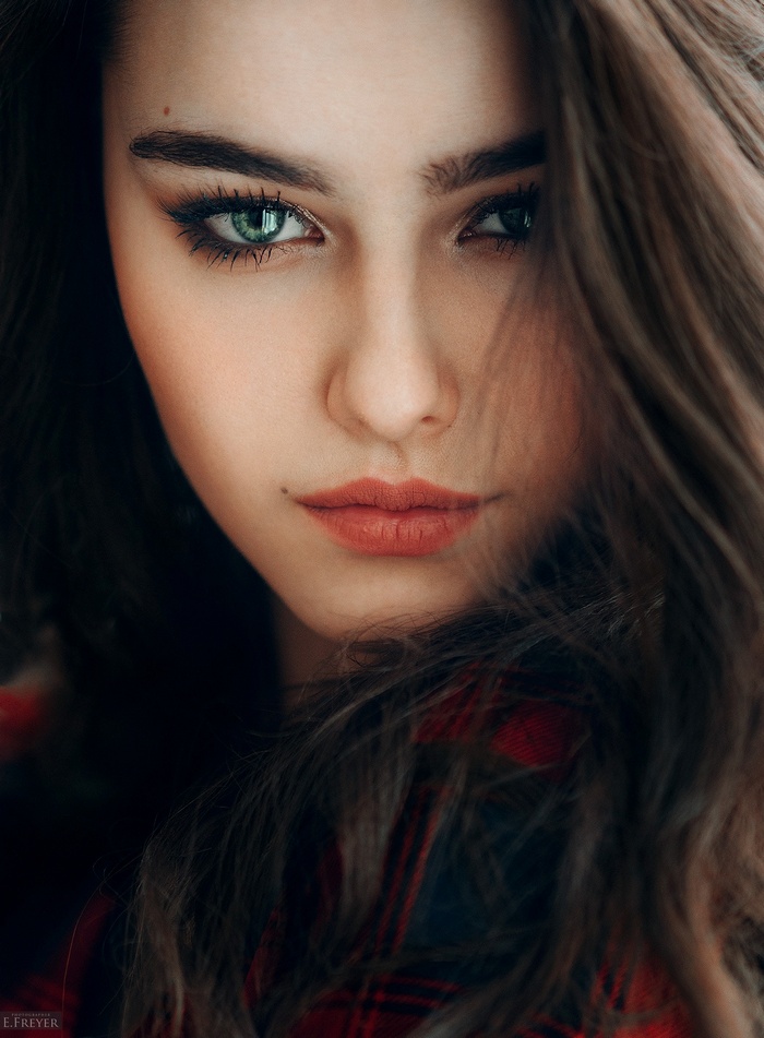 Portrait of a young woman with green eyes