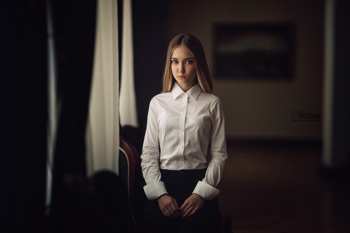 Woman in white shirt and black pants
