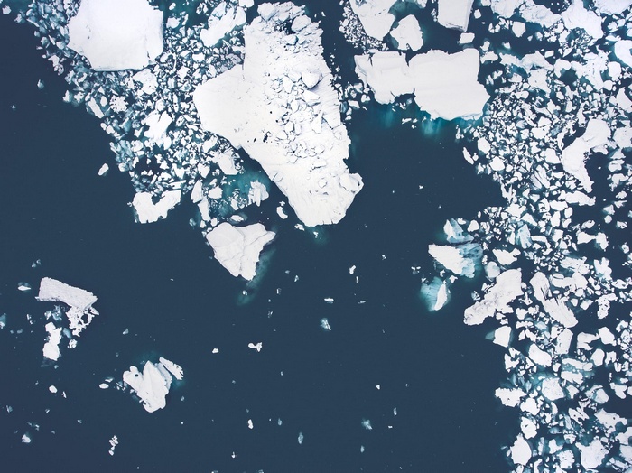 Aerial view of icebergs floating in dark water