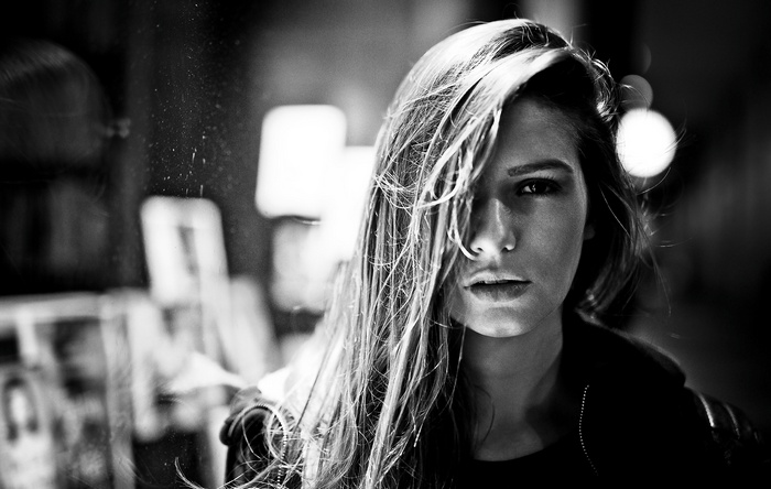 Monochrome portrait of a woman with hair across her face