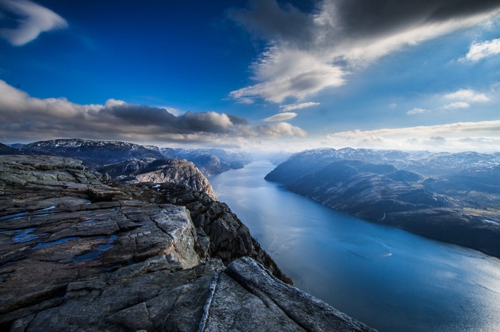 Majestic fjord landscape with mountains and clouds