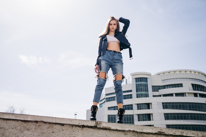 white tops, torn jeans, arms up, brown eyes, Kirill Sokolov, jeans, denim, looking at viewer, women, blonde, hands in hair, boots, leather jackets