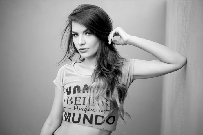 Monochrome portrait of a woman with hand in hair