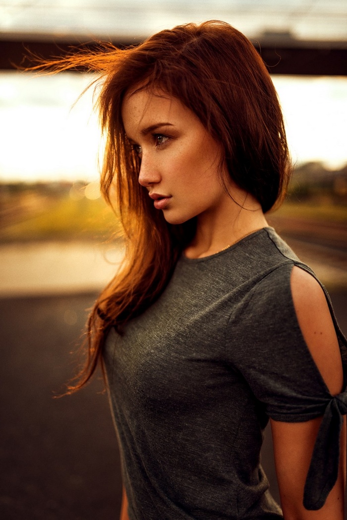 Woman with red hair in profile