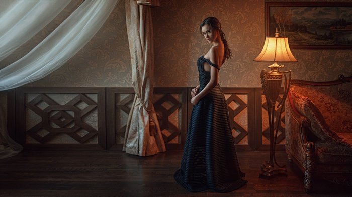 Woman in black dress by Georgy Chernyadyev