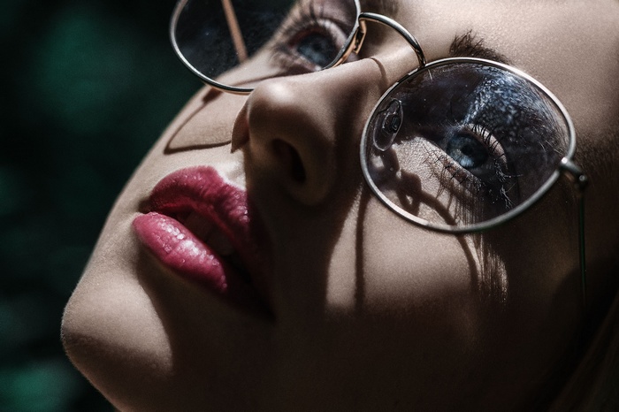 Close-up of a woman's face with glasses