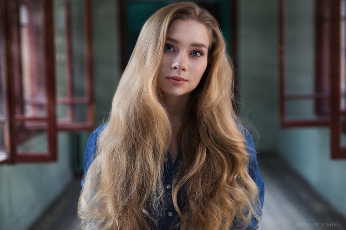 Portrait of a young woman with long blonde hair