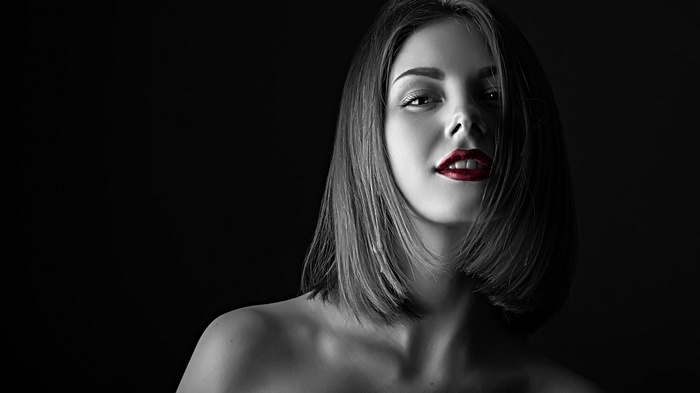 Woman with red lipstick and bare shoulders