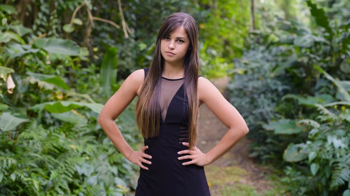 Woman in black dress in a forest
