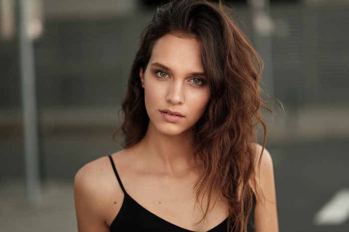 Portrait of a woman with brown wavy hair