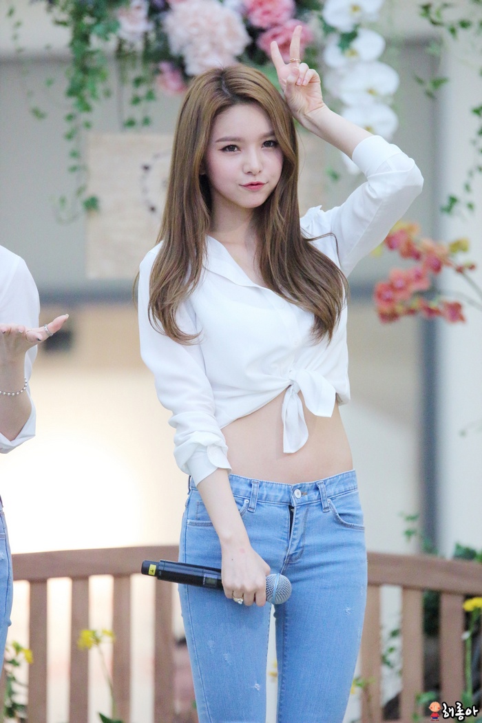 Woman from Hello Venus holding a microphone