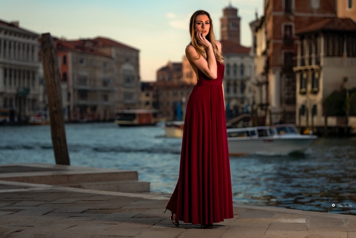 Woman in red dress in Venice