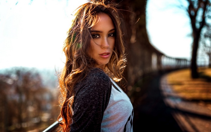 Woman with long brown hair outdoors
