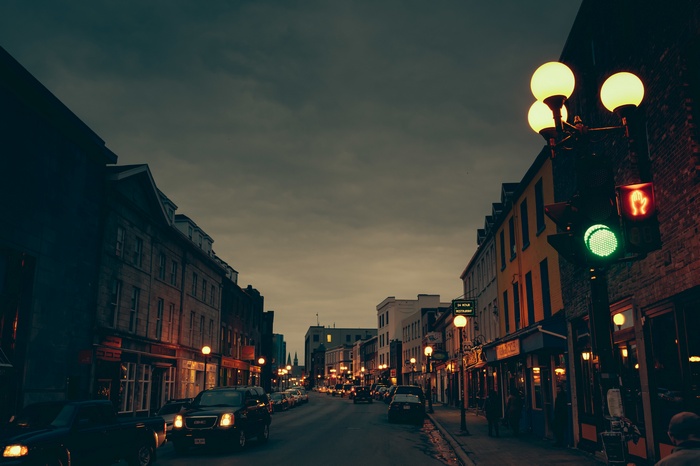 Cityscape at dusk with traffic lights and buildings
