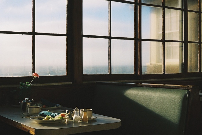 Table setting by a window in a restaurant