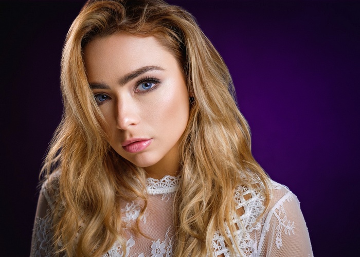Woman with blonde hair and blue eyes