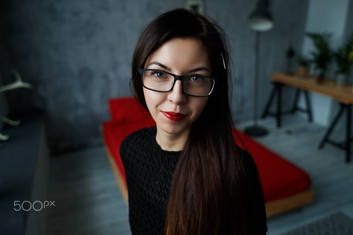 Woman with glasses and red lipstick
