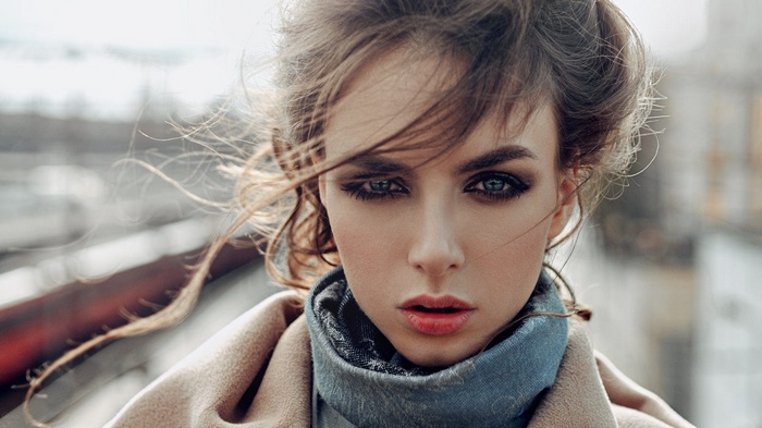 Woman with smoky eyes and windblown hair