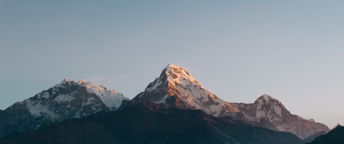 Snow-capped mountains under a clear sky