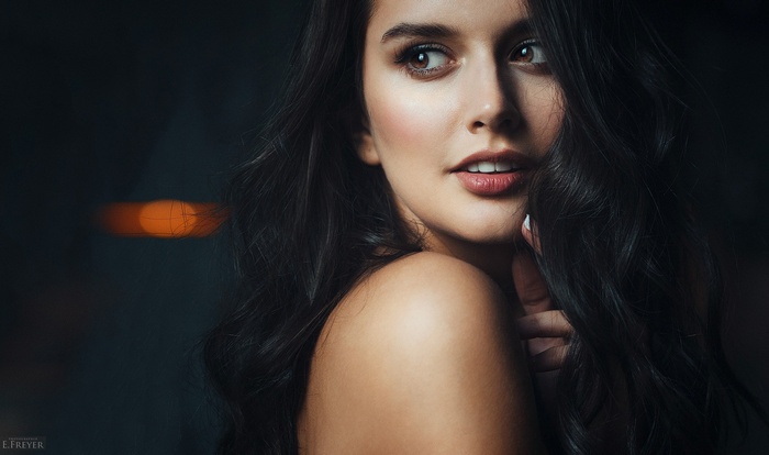Portrait of a woman with long dark hair