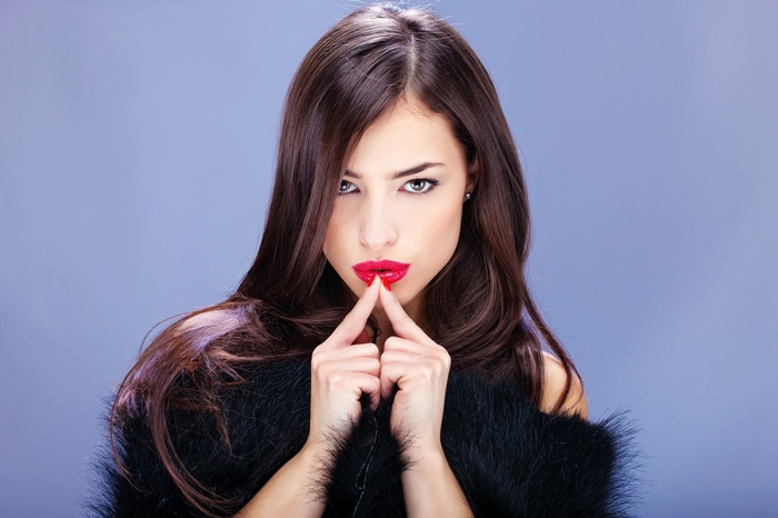 Woman in fur coat with red lipstick