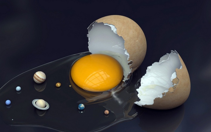 Cracked egg with planets and yolk