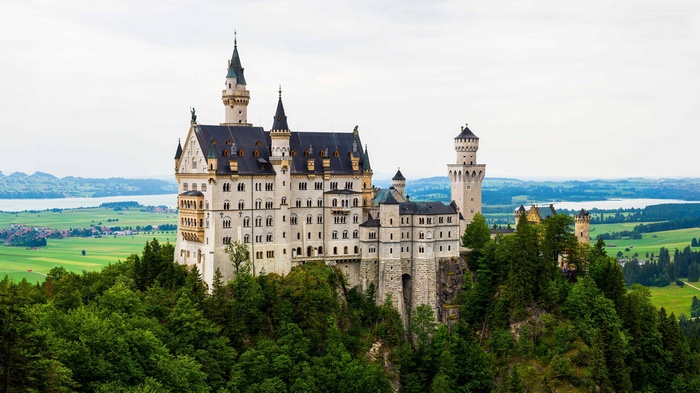 Neuschwanstein Castle in Germany with surrounding landscape