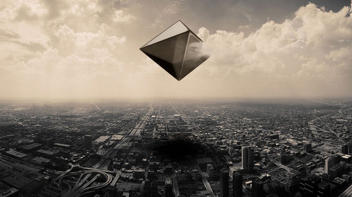 Ramiel the Angel from Neon Genesis Evangelion over a city