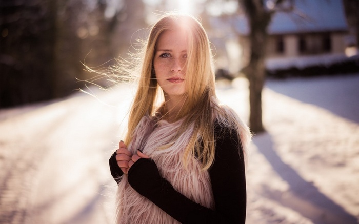 Woman in Fur Vest in Snowy Landscape