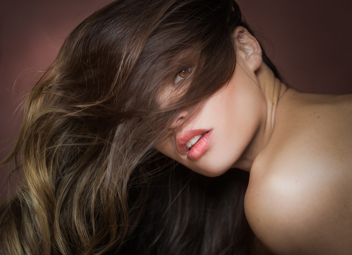 Portrait of a woman with hair in her face