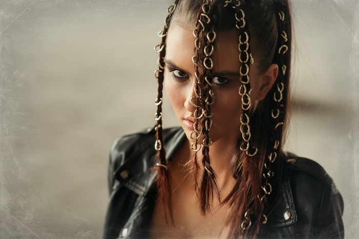 Woman with braided hair and metal rings