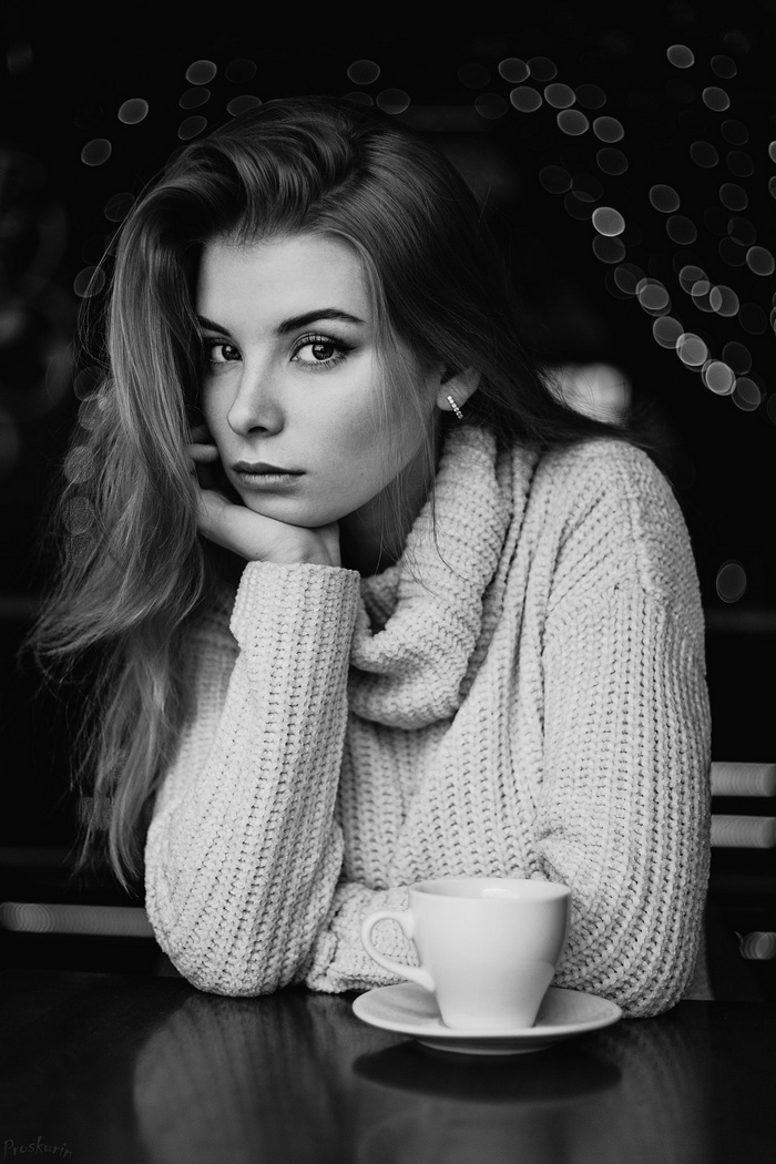 Monochrome portrait of a woman with a cup of coffee
