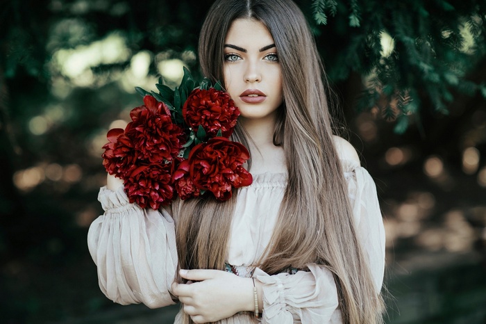 Woman with red flowers and long hair
