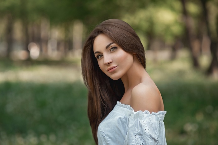 Portrait of a woman with long brown hair