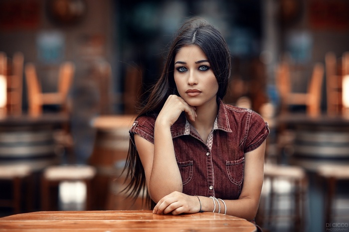 Woman with blue eyes and dark hair