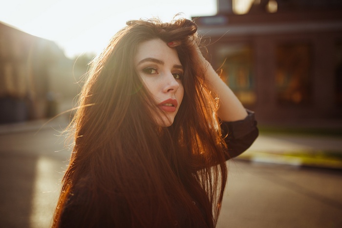 Woman with long brown hair outdoors