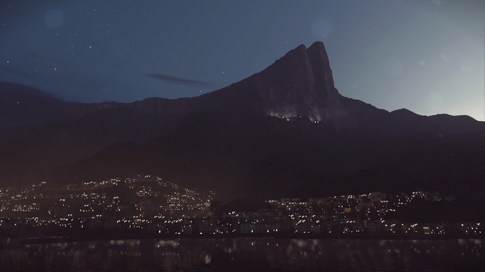 City lights at the base of a mountain at night