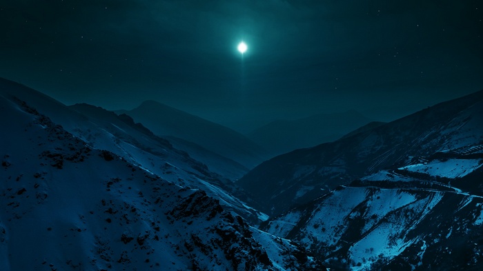 Snowy Alborz mountains at night under moonlight
