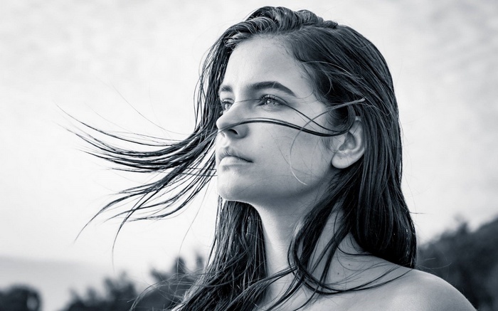 Barbara Palvin looking away with windblown hair