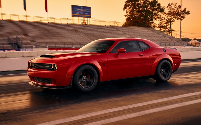 Red Dodge Challenger SRT on a race track
