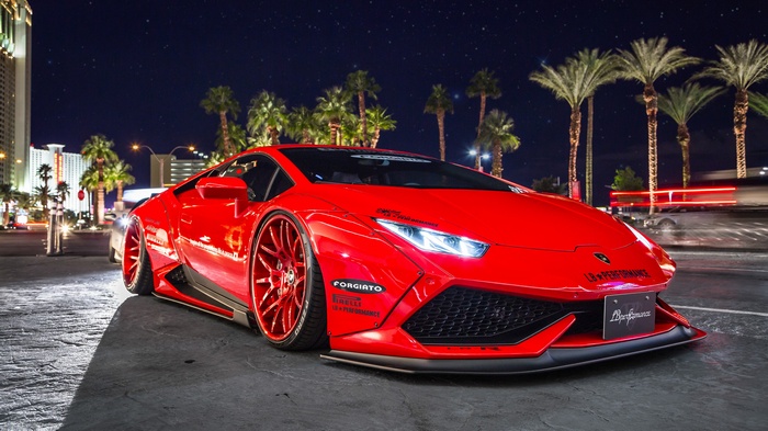 Red Lamborghini Huracan with custom wheels at night