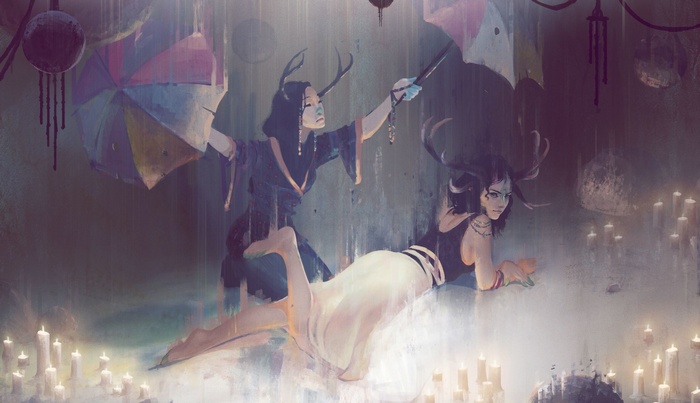 Two women with antlers in the rain with umbrellas and candles