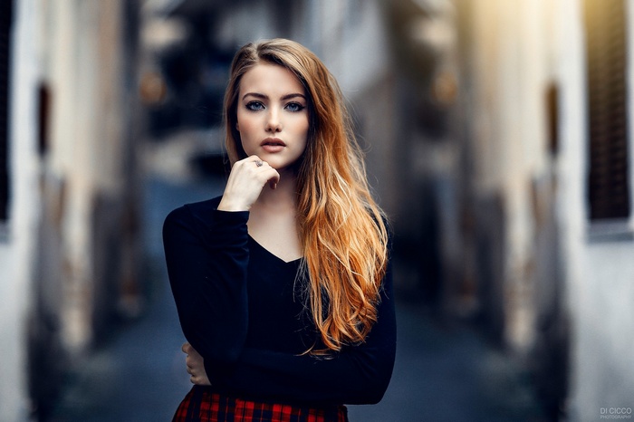 Woman with long red hair and blue eyes