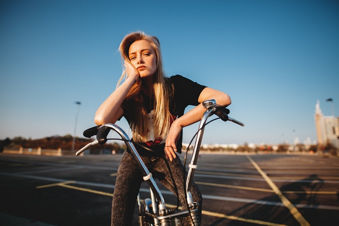 Woman with blonde hair on a bicycle