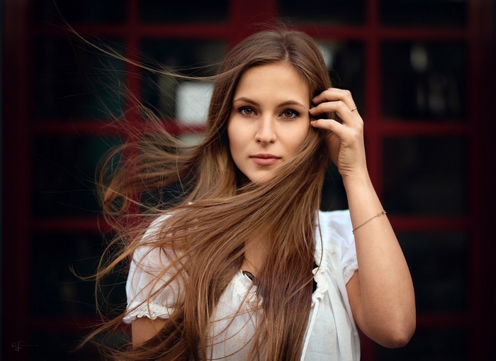 Portrait of a young woman with long brown hair
